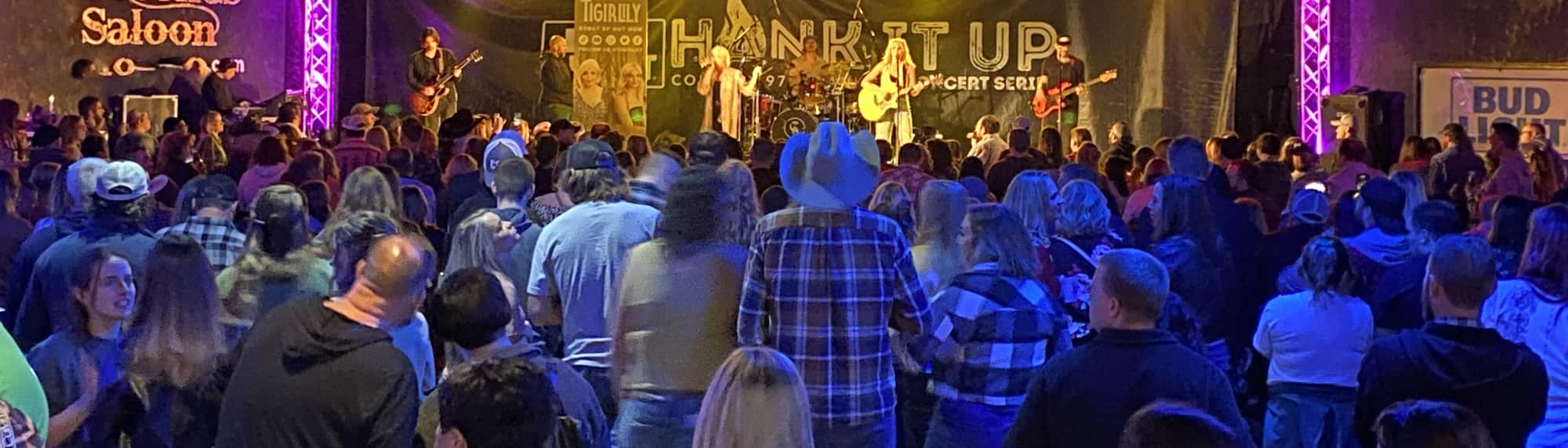 country concert with fans wearing cowboy hats Winston-Salem