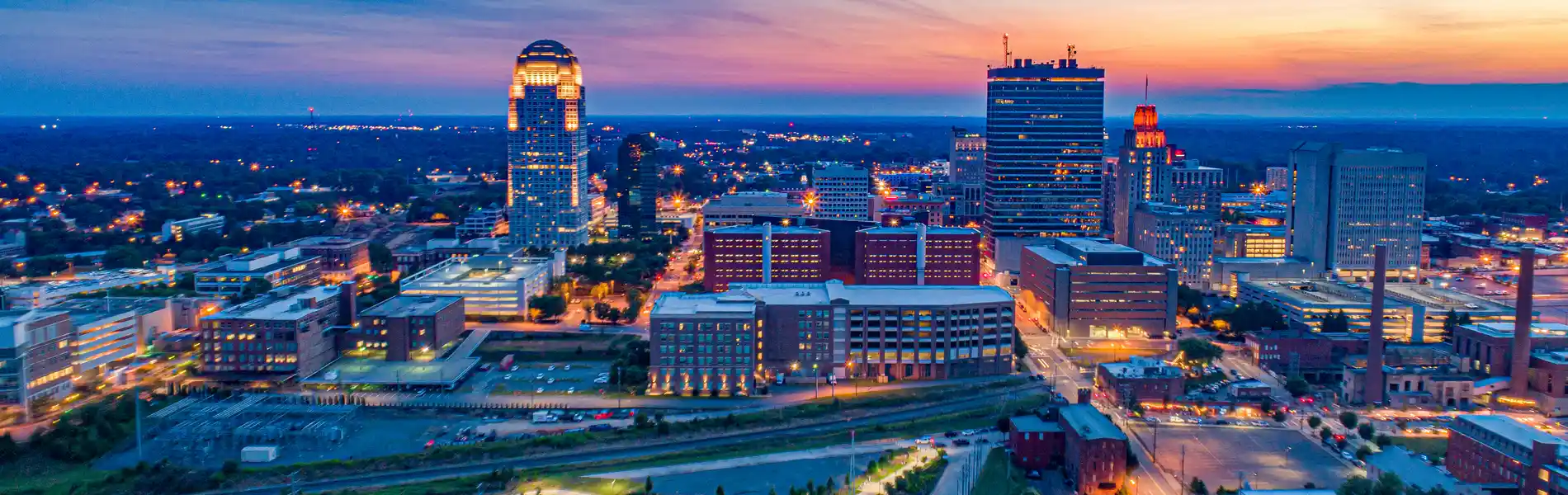 Neon color image of a band playing and people singing along